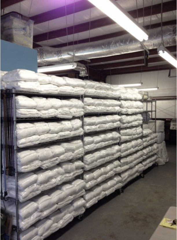 An image displaying fresh linens stocked and ready for rental